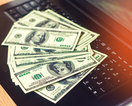 dollars on the keyboard, the concept of buying on the Internet, investment, success, gambling....