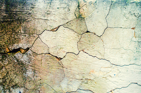 cracked wall, peeling plaster, Aged wall texture, background for design.

の写真素材