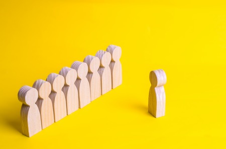 People listen to the leader. People stand in line at the briefing and wait for orders. Wooden...
