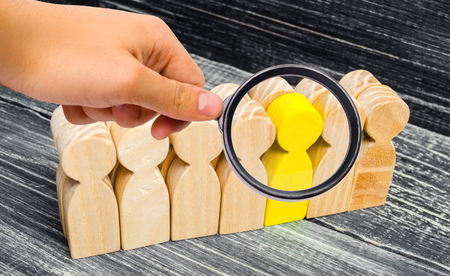 the person leaves / stands out from the crowd. leadership in the business team. a talented worker. special opinion. the chosen one among others. Promotion. Concept of search for worker. recruitingの写真素材