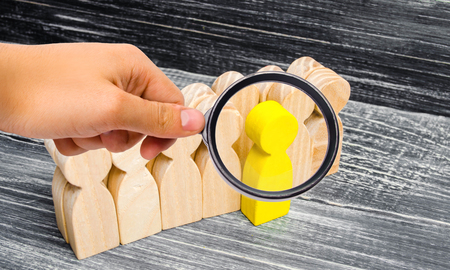 the person leaves / stands out from the crowd. leadership in the business team. a talented worker. special opinion. the chosen one among others. Promotion. Concept of search for worker. recruitingの写真素材