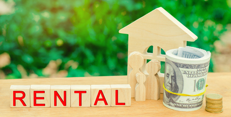 Wooden house, money with the inscription rental. Rental of property, apartments. services of a realtor. affordable housing, rental prices. real estateの写真素材