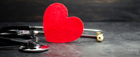 Red heart and stethoscope. The concept of medicine and health insurance, family, life. Ambulance. Cardiology Healthcare.の写真素材