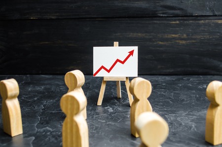 People gathered for a meeting and look at the speech of the leader. Meeting or report for the past period. Analytics and strategy planning. Profit and income analysis business webinar. Selective focusの写真素材