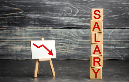 The inscription "salary" and the red arrow down. lower salary, wage rates. demotion, career decline. lowering the standard of living. wage cuts. decrease in profits and family budgetの写真素材