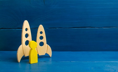 A golden man stands near missiles. Selection of candidates for flight into space. The first...