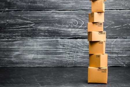 A tower of cardboard boxe. The concept of online sales, shopping and online shopping. Realization of goods and services through the Internet. buying and selling goods. Place for textの写真素材