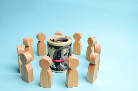 Dollars in the center of the team. The concept of investing in a business project. Discussion of...