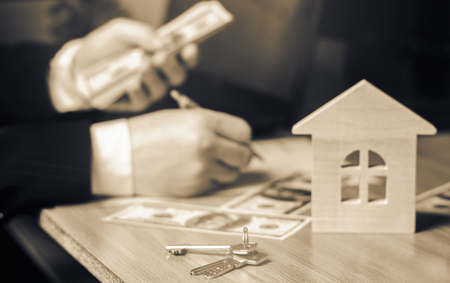 Real estate concept. Buying and selling homes. Rent apartment. Sale of property. Mortgage and payment of taxes. Debt and loan. Purchase. Home sold. Real Estate Agent Servicesの写真素材
