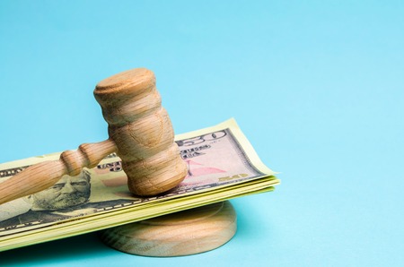 US dollars and judge's hammer / gavel. The concept of corruption in the state and government. Court....