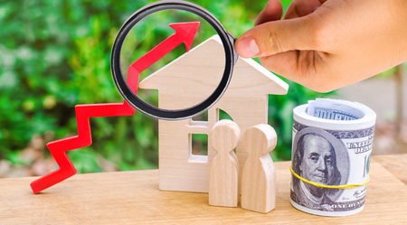 wooden house, money with a red arrow up. concept of high demand for real estate. rise in house prices. population growth. increase in the cost of utilities. property.の写真素材