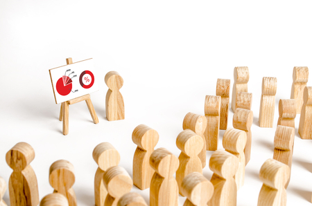 A person holds a presentation to a crowd of people at a briefing, a discussion of the business strategy, development of the company. Analysis of the results, information market analysis and marketingの写真素材