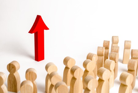 A group of people looks at the red arrow up. Search for new opportunities and options, increase in work or increase in indicators of living standards. Self-improvement and achievement of new successesの写真素材