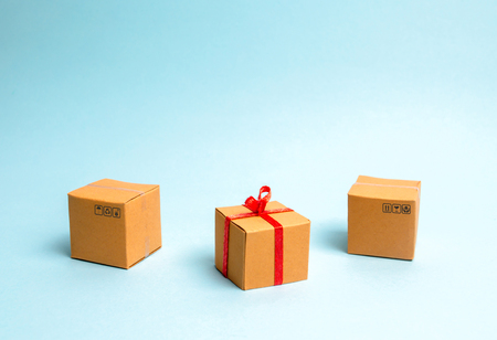 A gift box lies among other boxes. The concept of selling goods and services, buying gifts for...