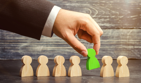 Businessman in search of new employees and specialists. The concept of personnel selection and management within the team. Dismissal and hiring people to work. Human Resource Management.の写真素材