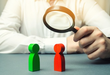 The arbitrator examines the conflict situation between people. Search for solutions and compromises. Conflict of interest. Smoothing disputes. Court and law. Justice. Verdict. Legal supportの写真素材