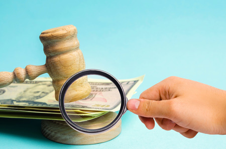 US dollars and judge's hammer / gavel. The concept of corruption in the state and government. Court....