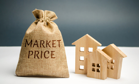The concept of the market price of housing and premises for business. Buying and selling real estate at average market prices. Pricing cost per square meter of real estate. Property appraisal valueの写真素材
