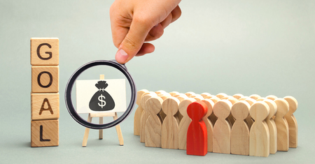 Wooden blocks with the word Goal, money and business team. Business concept. Cooperation and...