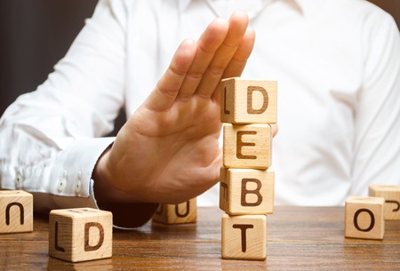 Businessman refuses to take a loan. Refusal of loans with high interest rates. Inability to pay the debt. Unprofitable terms of business lending by banks, expensive money. Economic instability.の写真素材