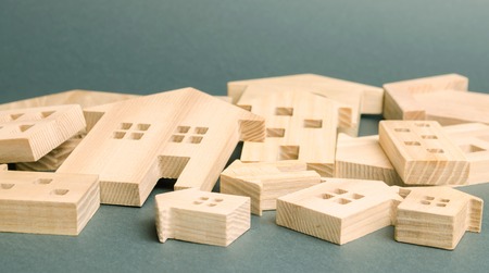 Many felled wooden houses. Destruction of houses as a result of natural disaster. The flood....