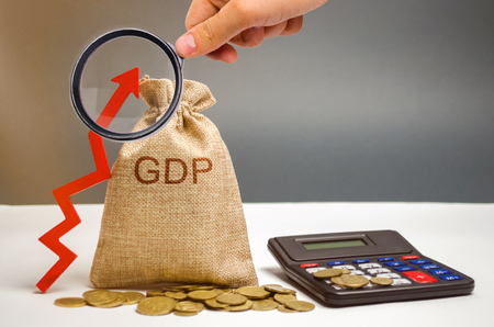 Money bag with the word GDP and up arrow. Technological progress, increasing the level of workers, improving the allocation of resources, improving the management of production activitiesの写真素材