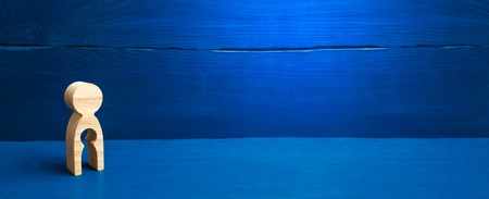 The concept of the loss of child, abortion of pregnancy, miscarriage. Infertility in women. unhappy mother lost her child. A wooden figure of a woman with a void inside in the shape of a childの写真素材