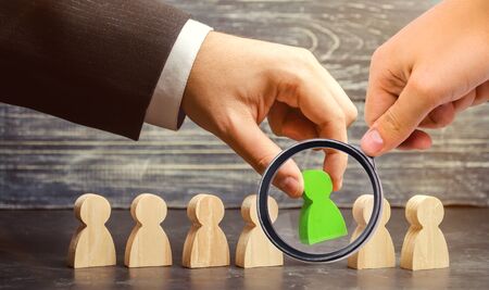 Businessman in search of new employees and specialists. The concept of personnel selection and management within the team. Dismissal and hiring people to work. Human Resource Management.の写真素材