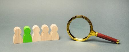 Team of employees and magnifying glass. Search for people. Attraction to work. Human Resource...