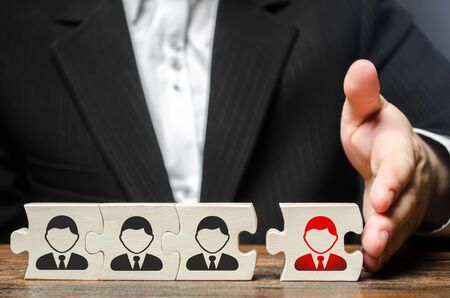 A businessman joins a new employee to the team as its leader. Assembly of the new business team for the project from the proven employees. increasing efficiency. Work with staff, business organizationの写真素材