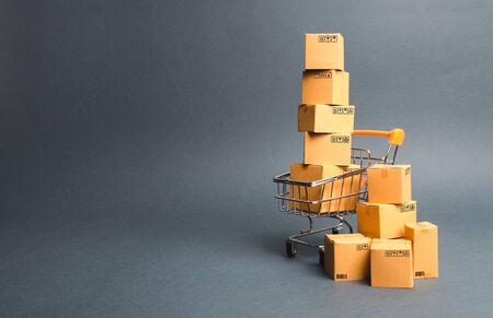 Shopping cart supermarket with boxes. Sales of products. The concept commerce, online shopping....