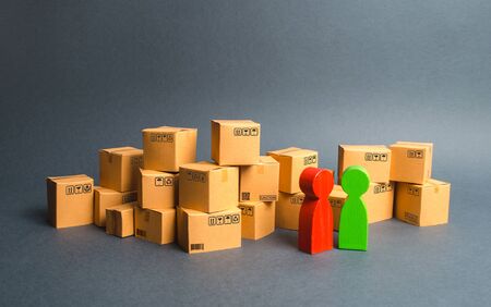 Many boxes and a communication between the buyer and the seller, or between the manufacturer and the retailer. Discussion of the terms of trade, purchase of goods and services. Business and commerce.の写真素材