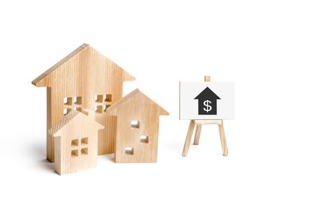 Three houses and a sign on a white background. Buying and selling of real estate, construction. Apartments and apartments. City, settlement. Minimalism. for presentations. real estate market. A Townの写真素材