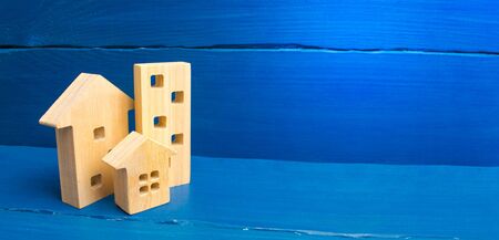 Buying and selling of real estate, construction. Apartments and apartments. City, settlement. Minimalism. for presentations. real estate market. houses on a blue background. banner, place for textの写真素材