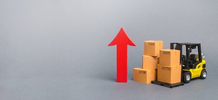 Yellow Forklift truck with cardboard boxes and a big red arrow up. trade between countries, popularity of national goods, economic rate growth production goods and products, Banner, copy spaceの写真素材