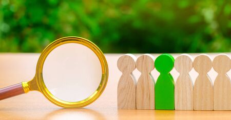 Team of workers and magnifying glass. Search for people. Attraction to work. Human Resource Management. Hiring. Promotion. Talented worker. Working staff. Employee. Recruiting. Hire. Hrの写真素材