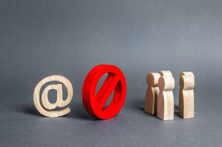 An internet email symbol and a group of people are separated by a red prohibitory symbol No. restrictions on access to the global Internet. Censorship. Information control, society isolation policyの写真素材