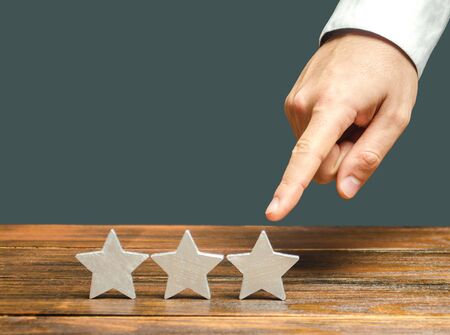 Critic points to third star. The concept of the rating of hotels and restaurants. The evaluation of...