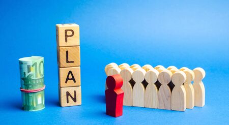 Wooden blocks with the word Plan and a business team standing next to money. Strategy planning. Management business concept. Improving the efficiency of the company's sales. Achieving financial targetの写真素材
