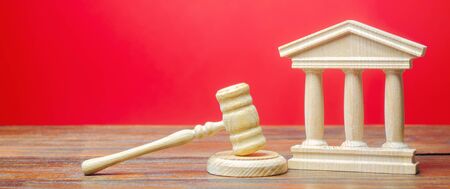 Courthouse and gavel. International Court. Protection of business interests and human rights. Intellectual property. Justice and legitimacy. Lawmaking. Judicial system. Judge's Hammer. Copy spaceの写真素材