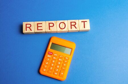 Wooden blocks with the word Report and calculator. Business Financial Reporting Concept. Evaluation of the financial position. Audit. Profit, budget, income. Balance sheet. Cash flowの写真素材