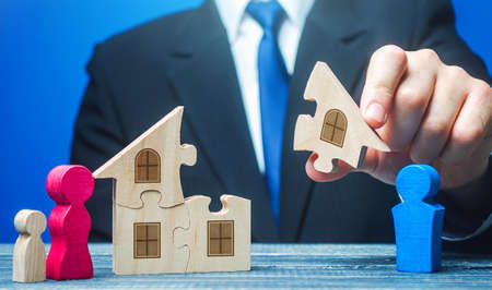 Man shares property between an ex-husband and wife with a child after a divorce. Division of marital property real estate. Dispute Conflict resolution. Legal regulation. Divorcementの写真素材
