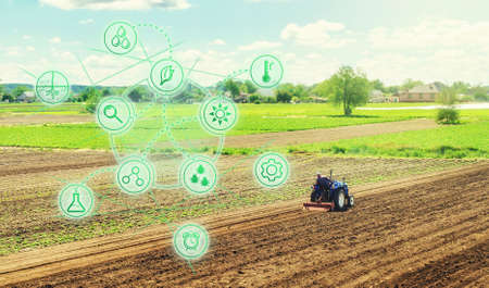 Futuristic innovative technology pictogram and a farmer on a tractor. Science of agronomy. Farming and agriculture startups. Improving efficiency. Technology Improvement in quality and yield growth.の写真素材
