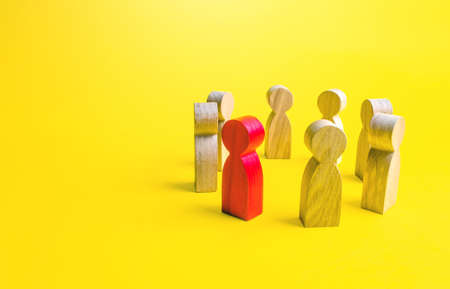 Red man stands with people in a circle. Communication and diplomatic negotiation process. Leader leadership qualities. Cooperation and collaboration. Spy. Social toxicity. Community dialogue. Briefingの写真素材