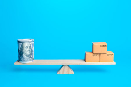 Money bundle of dollars and boxes on scales.の写真素材