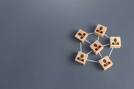 Blocks with businessmen connected by lines into a network team. Participation and assistance in a common project. Communication and feedback. An efficient small optimal compact business team.の写真素材
