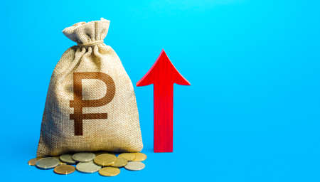 russian ruble money bag with red arrow up. Raising taxes. Deposit interest. Increase in profitability and prosperity, higher living standards. Recover financial system after crisis. Budget growth.の写真素材