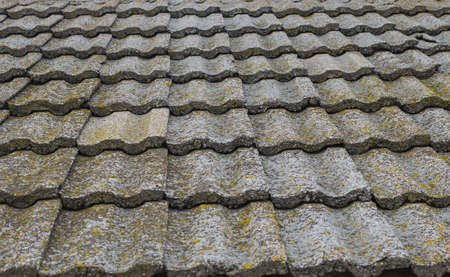 Old stone roof tiles texture. Obsolete roof covering buildings. Old European architecture.の写真素材