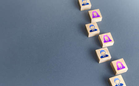 A row of blocks with employees. Recruiting and staffing. Search and recruitment of new employees. Human resources. Find best talent candidate for an open role job. Copy space.の写真素材
