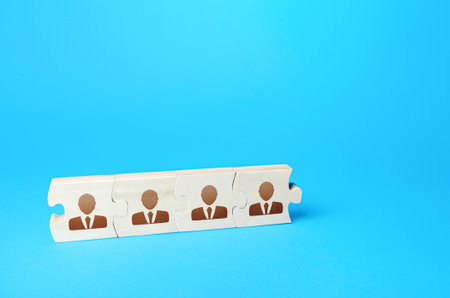 Connected puzzles people. Concept of recruiting new employees and expanding the staff of business company. Team building and bonding. Recruiting specialists. Partnership and cooperation. Collaborationの写真素材